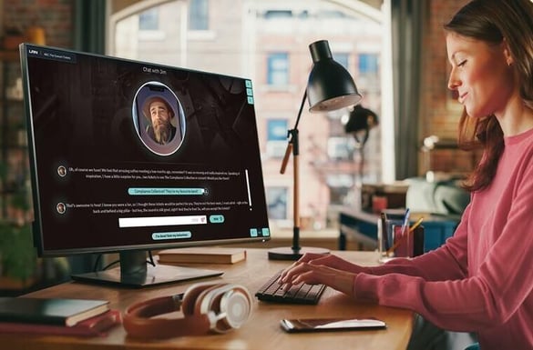 A person sitting at a desk with a computer